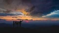 The four people standing on an evening mountain 4k or 4k+ Resolution
