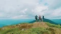 The four people standing on the mountain with a beautiful landscape 4k or 4k+ Resolution