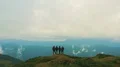 The four people standing on the mountain with a beautiful landscape 4k or 4k+ Resolution