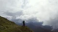 The four people standing on a mountain on a cloud background 4k or 4k+ Resolution