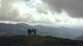 The four people standing on the mountain 4k or 4k+ Resolution