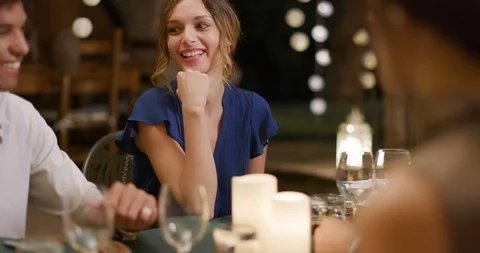 Four people, two couples happy talking and eating during a romantic gourmet 動画素材 107629397
