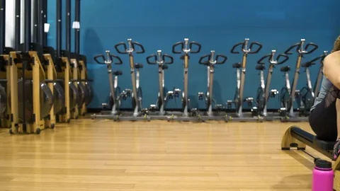 Four people using rowing machines 動画素材 77082031