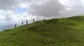 The four people walking up the beautiful mountain 4k or 4k+ Resolution