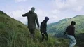 The four people walking down in the mountain. slow motion 4k or 4k+ Resolution