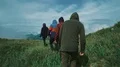The four people walking on a mountain with a beautiful view 4k or 4k+ Resolution