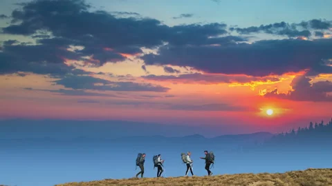 The four people walking on the mountain range Stock-Footage 141031966