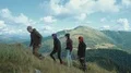 The four people walking up in the mountain. slow motion 4k or 4k+ Resolution