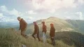 The four people walking up in the mountain. slow motion 4k or 4k+ Resolution