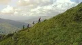 The four people walking to a mountain top 4k or 4k+ Resolution