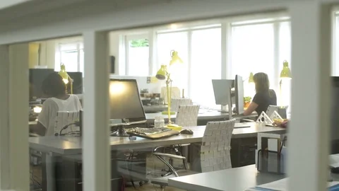 Four people working in an office 動画素材 83396133