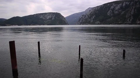 Four pillars abandoned water remaining from a former wharf. A view of the lake 6 Stock Footage 59756624