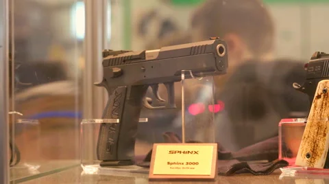 Four Pistols Are on the Shelf. View on Gun Barrel Stock Footage 68601353