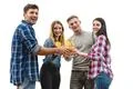 The four positive people clink glasses on a white background Photo
