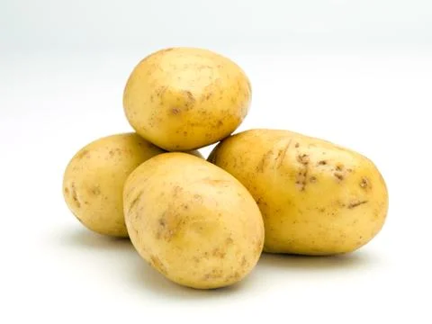 Four Potatoes Stock Photos