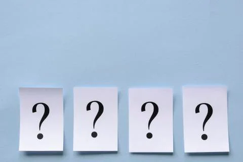Four printed question marks on white paper Stock Photos