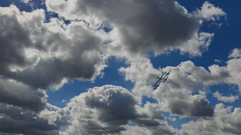 Four Propeller Aircraft Flying in Formation Across Dramatic Sky Видео 345064091