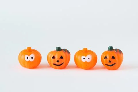 Four pumpkins on white background. Stock Photos