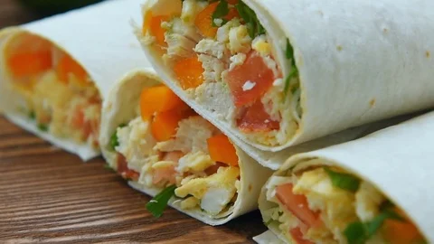 Four ready freezer breakfast burritos Stock Footage 69748262
