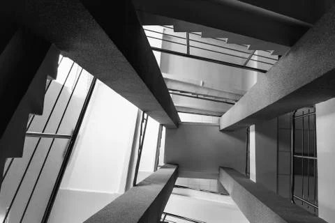 Four rectangular columns, staircases with metal chrome railing, abstract pers Foto stock