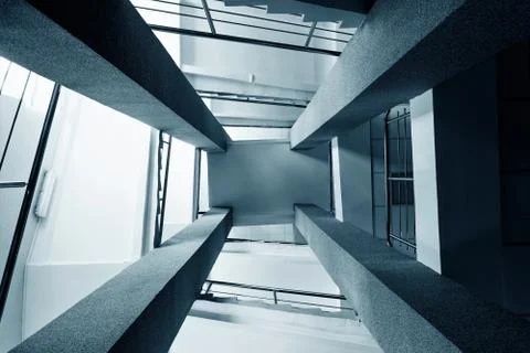 Four rectangular columns, staircases with metal chrome railing, abstract pers Foto stock