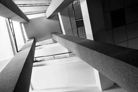 Four rectangular columns, staircases with metal chrome railing, abstract pers Foto stock