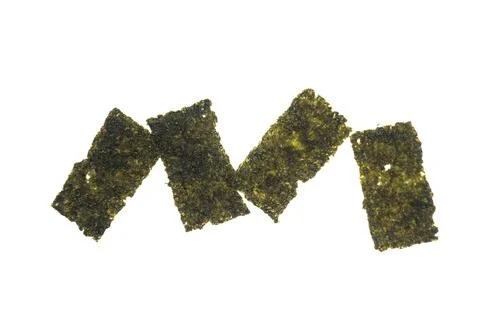 Four rectangular pieces of dried seaweed on a white background. Stock Photos