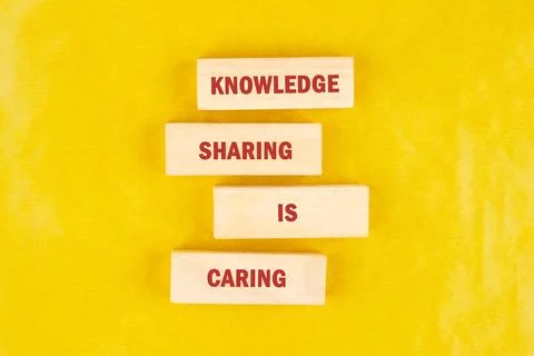 Four rectangular wooden blocks are stacked vertically, forming the phrase Stock Photos