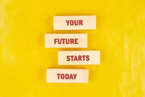 Four rectangular wooden blocks, stacked, each displaying a word in red letter 스톡 사진