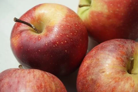 Four red apples Stock Photos