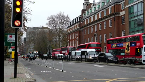 Four red buses in Euston road in London Vídeo Stock 144869263