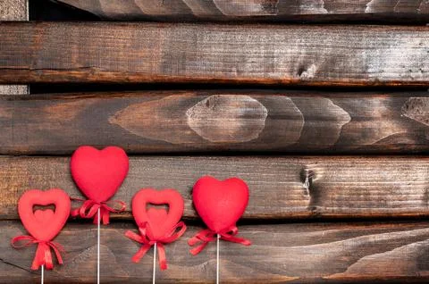 Four red hearts on sticks. Stock Photos