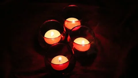 Four red votive candles Stock Footage 11019614