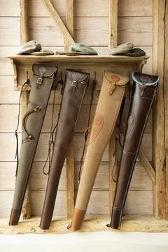 Four rifles in cases Stock Photos
