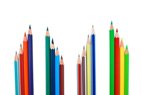 Four rows of different colored wood pencil crayons placed before a white back Stock Photos
