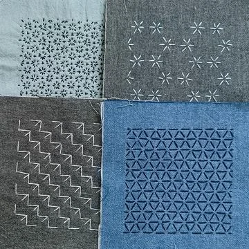 Four sashiko embroidery patterns displayed together Stock Photos