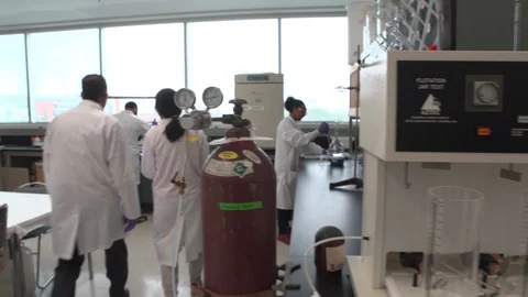 Four scientist in the lab Stock Footage 106900785