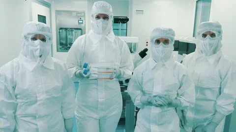 Four scientists standing in the cleanroom Stock Footage 165081973