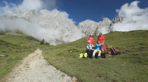 Four senior hikers looking into map Stock Footage 525258