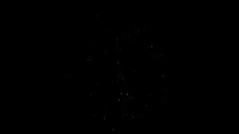 Four separate explosions of colored fireworks on a black background Stock Footage 285603712