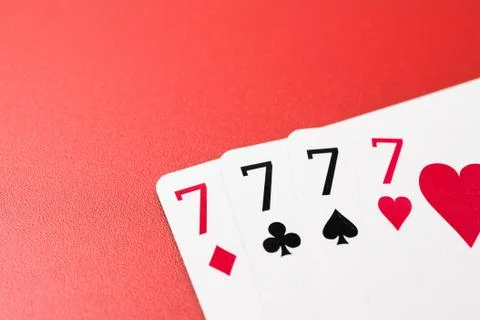 Four seven playing cards Stock Photos