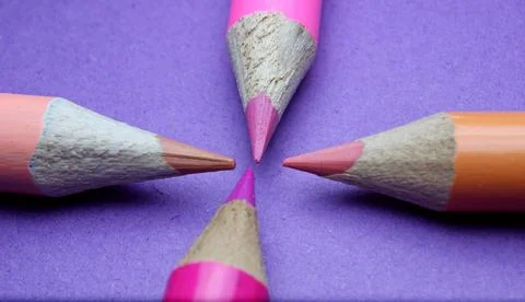 Four sharpened pencils of different colors close-up Stock Photos