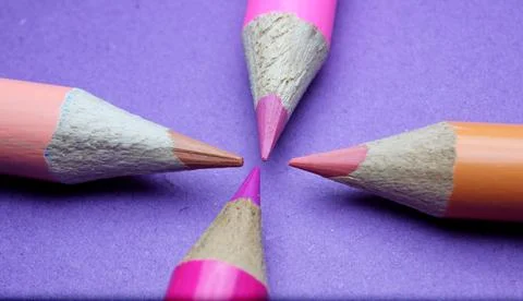 Four sharpened pencils of different colors close-up Stock Photos