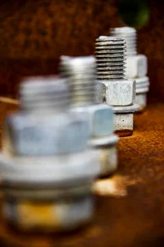 Four silver screws Stock Photos