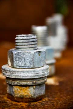 Four silver screws Stock Photos
