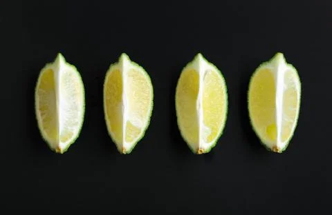 Four slices of lime Stock Photos