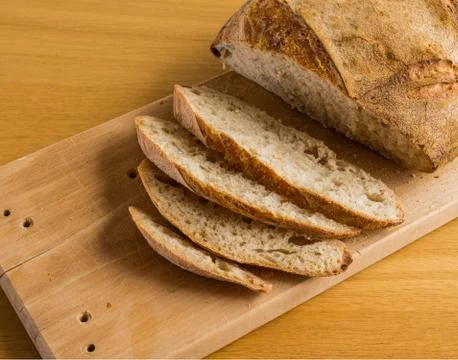 Four slide and a piece of bread made in "diy" course Stock Photos