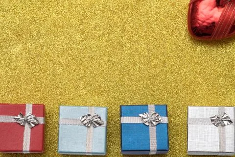 Four small box on yellow background Stock Photos