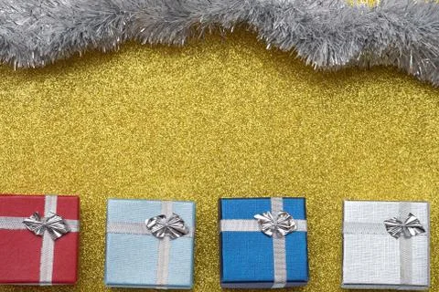 Four small box on yellow background Stock-Fotos