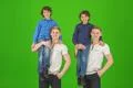 The four smile brothers stand on the green background Photo